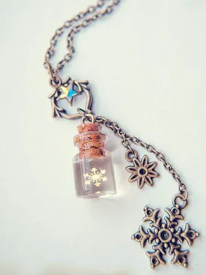 Golden snowflake glass bottle pendant necklace